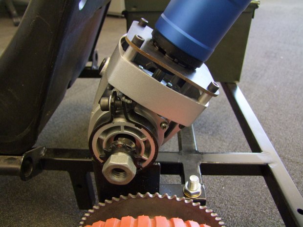The motor and grinder gearbox mounted together on the frame.